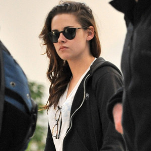 Kristen Stewart arrives at LAX behind a pair of sunglasses. Kristen Stewart arrives at LAX behind a pair of sunglasses.